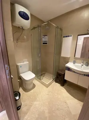 a bathroom with a shower and a toilet and a sink at Nid douillet à Gueliz in Marrakech