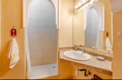 a bathroom with a sink and a shower at The Majestic Marrakesh Villa 16 in Marrakech