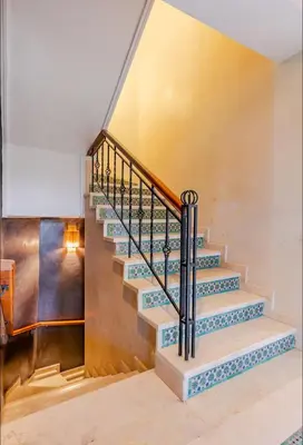 a staircase in a house with blue and white steps at The Majestic Marrakesh Villa 16 in Marrakech