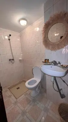 a bathroom with a toilet and a sink at Riad Hayat in Marrakech