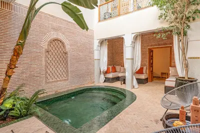 a pool in the courtyard of a house at Riad Thé d'Orient - Piscine Privée - Petit Déjeuner in Marrakech