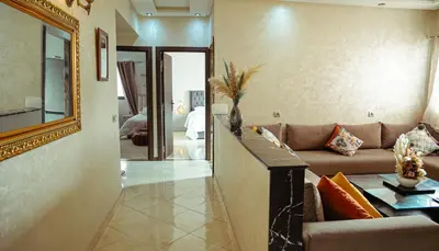 a living room with a couch and a mirror at Apartment in Marrakech in Marrakech