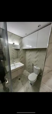 a bathroom with a toilet and a sink and a tub at Superbe Appartement proche centre marrakech, neuf tout équipé in Marrakech