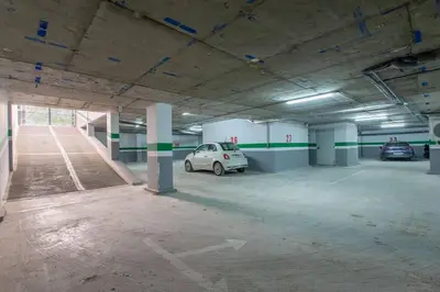 a parking garage with two cars parked in it at Contemporary luxe, heart of Gueliz fibre optq IPTV in Marrakech