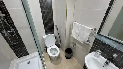 a small bathroom with a toilet and a sink at Magnifique Appartement Marrakech - 2 Chambre 2 Salle de Bains in Marrakech