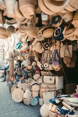 a display of straw hats and baskets in a store at Magnifique Appartement Marrakech - 2 Chambre 2 Salle de Bains in Marrakech