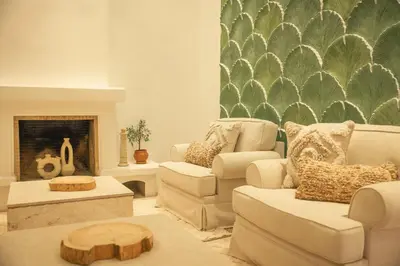 a living room with two couches and a fireplace at Les Palmiers Boutique Hôtel & Spa in Marrakech