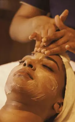 a man getting his head covered in chocolate at Riad Dar Fena By K&G &jacuzzi in Marrakech