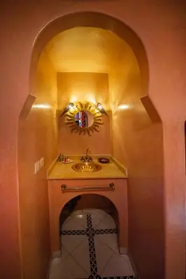 a bathroom with a sink and a mirror at La lune de Marrakech Riad in Marrakech