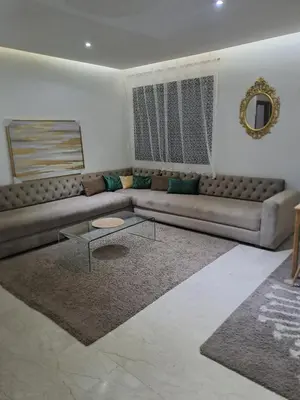 a living room with a couch and a table at Chez Dar safaa in Marrakech