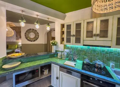 a kitchen with green counter tops and a sink at Maison Maria Palmeraie in Marrakech