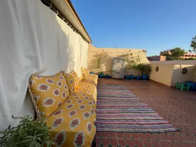 a row of pillows sitting on a patio at Riad Mama Toutou in Marrakech