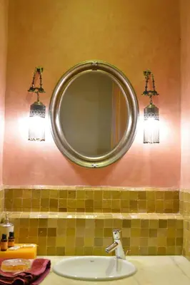 a bathroom with a mirror and a sink at Palmeraie Stay - Pool & Lake in Marrakech
