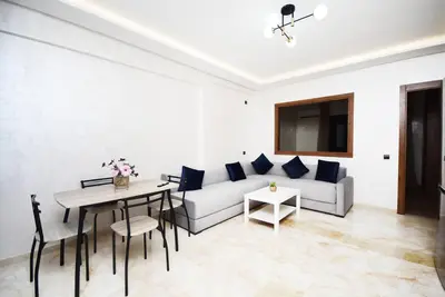 a living room with a couch and a table at Appartement Marrakech Hivernage. in Marrakech