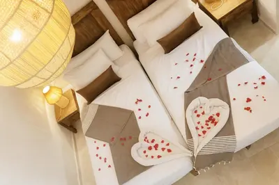 a hotel room with a bed with hearts on it at Riad Belikoss Pool & SPA in Marrakech
