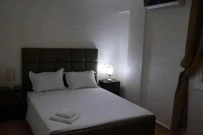 a bedroom with a large bed with two towels on it at studio, à proximité de la gare in Marrakech