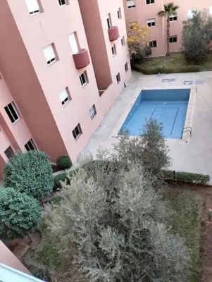 an overhead view of a building with a swimming pool at studio, à proximité de la gare in Marrakech