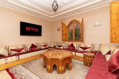 a living room with a couch and a table at Villa Korima in Marrakech
