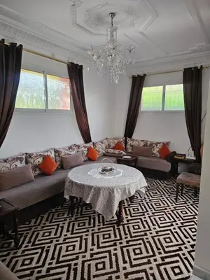 a living room with a couch and a table at Marrakech in Marrakech