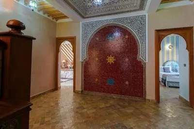 a room with a large door in a house at Villa Amerchiche in Marrakech