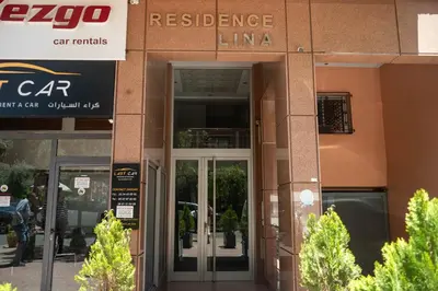 an entrance to a building with glass doors at L'appart by Louhou Collection in Marrakech