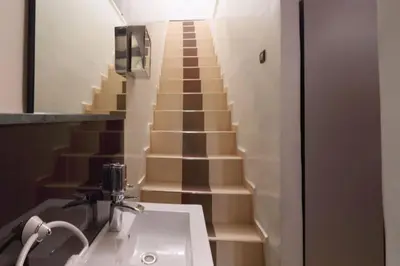 a bathroom with a sink and a staircase at Appartement centre de Marrakech in Marrakech