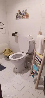 a bathroom with a white toilet in a room at maison d'hôtes Le petit jardin Marrakech in Marrakech