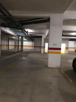 an empty parking garage with a parking lot at Cosy studio au centre de Marrakech Netflix in Marrakech