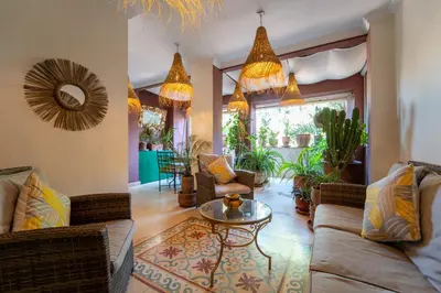 a living room with couches and a table at Luxueux 138 m2 avec piscine in Marrakech