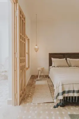 a bedroom with a bed and a pendant light at Riad Casa Kasbah in Marrakech