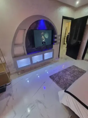 a bedroom with a tub with a tv in a room at Kech vacations Friendly! Luxury 2 bed apartment in Marrakech