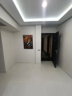 a white room with a painting on the wall at Kech vacations Friendly 2 Bedroom Luxury apartment in Marrakech