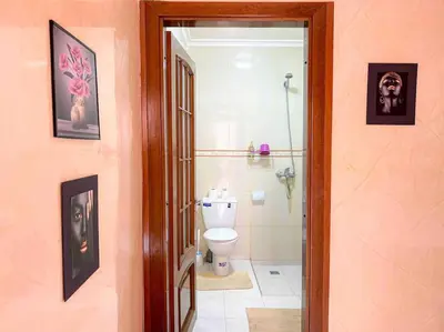 a bathroom with a white toilet and a shower at Appartamento nel quartiere Gueliz , Marrakech in Marrakech