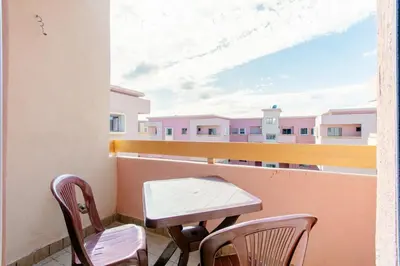 a table and chairs on a balcony with a view at Bel appartement à louer à Marrakech targa in Marrakech