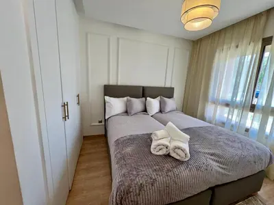 a bedroom with a bed with towels on it at Prestigia Luxury Appart 2 Room in Marrakech