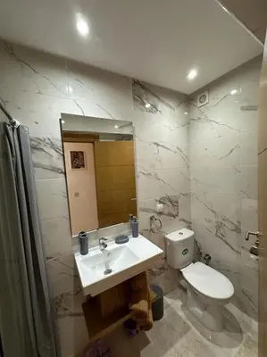 a bathroom with a sink and a toilet at Charm Apartment in Marrakech in Marrakech