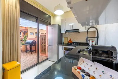 a kitchen with a counter with a box on it at L'Atlas - Appartement Authentique à Gueliz in Marrakech