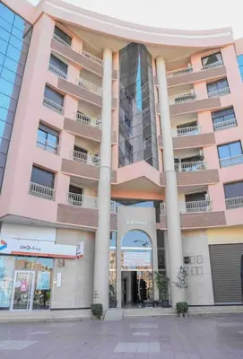 a large building with columns in front of it at Perle en plein Gueliz in Marrakech