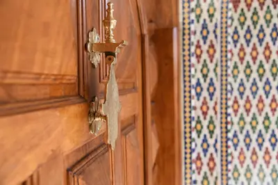 a wooden door with a tag hanging from it at Marrakech art in Marrakech
