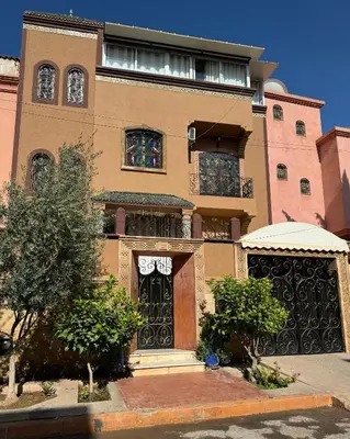 a large building with a gate and a building at Marrakech art in Marrakech