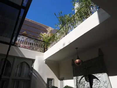 a balcony of a house with a fence at Riad Kamilyes in Marrakech