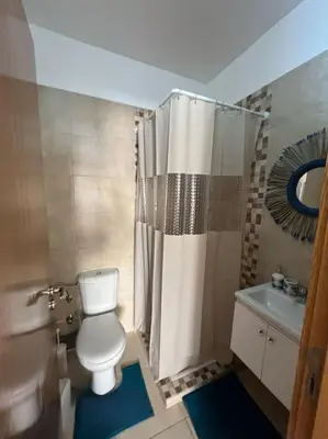 a bathroom with a toilet and a shower and a sink at NS 36 by Majestic Properties in Marrakech
