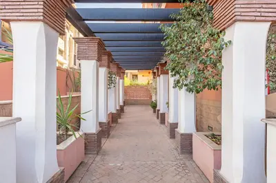 a hallway of a house with a blue ceiling at Bohemian Flat in Marrakech