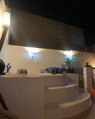 a set of stairs in a room with lights at Riad Le Roy’s in Marrakech