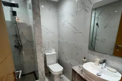 a bathroom with a toilet and a sink and a shower at 1Bed Apartment - Sleeps 4 - Balcony Wifi Parking in Marrakech