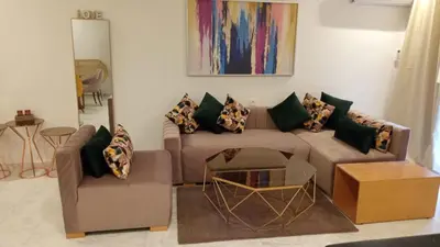 a living room with a couch and a table at 1Bed Apartment - Sleeps 4 - Balcony Wifi Parking in Marrakech
