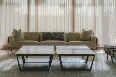 a living room with a couch and two tables at VIP villa in Marrakech