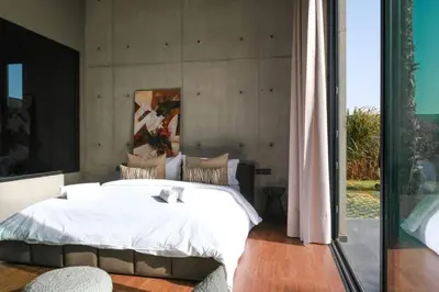 a bedroom with a large white bed with a window at VIP villa in Marrakech