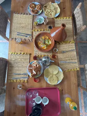 a wooden table with food on top of it at Villa BALI KECH in Marrakech