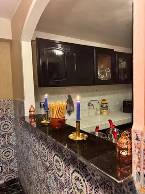 a kitchen counter with candles on top of it at Riad khoya magnifique in Marrakech